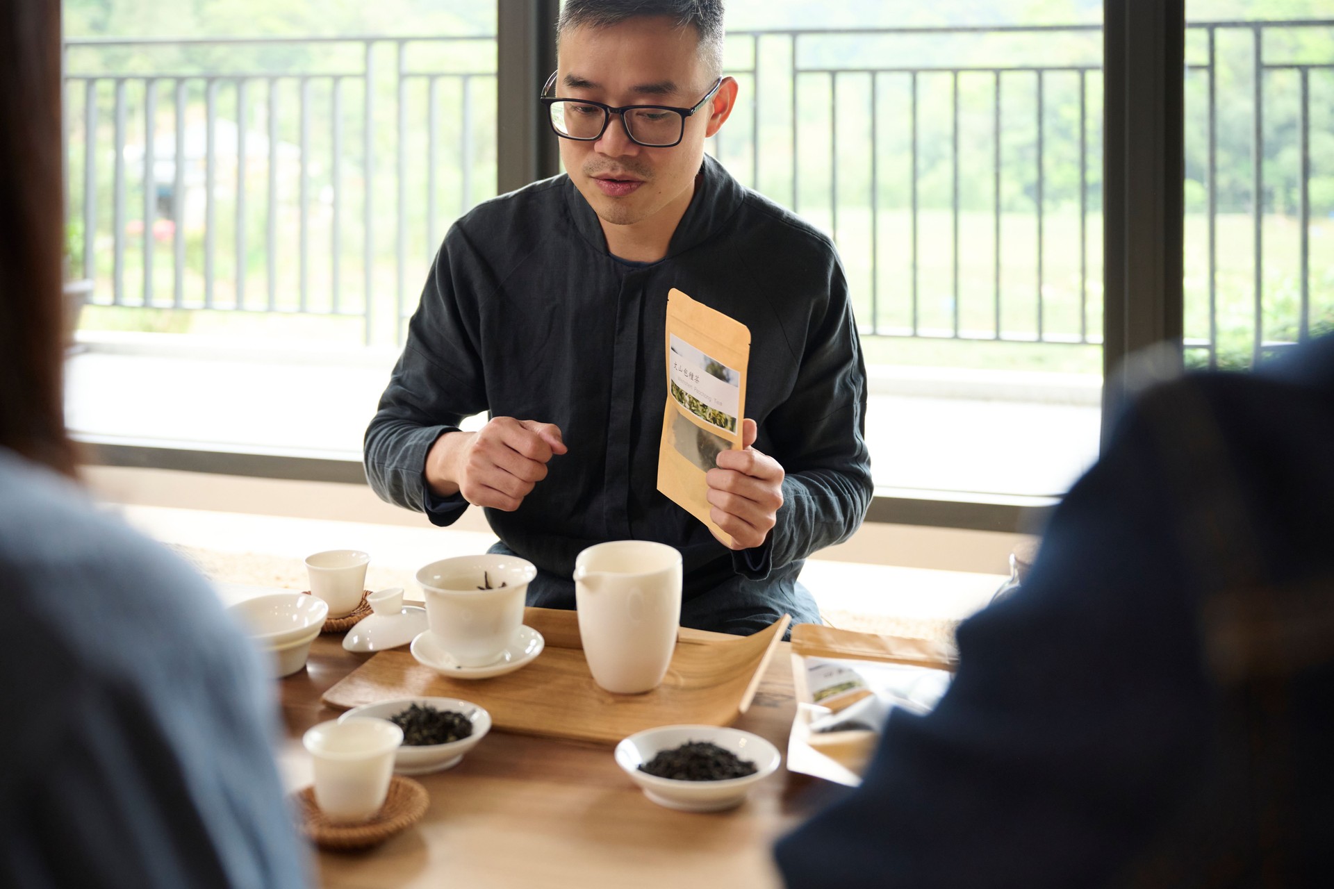 Small business owner promoting his tea products for his customer.