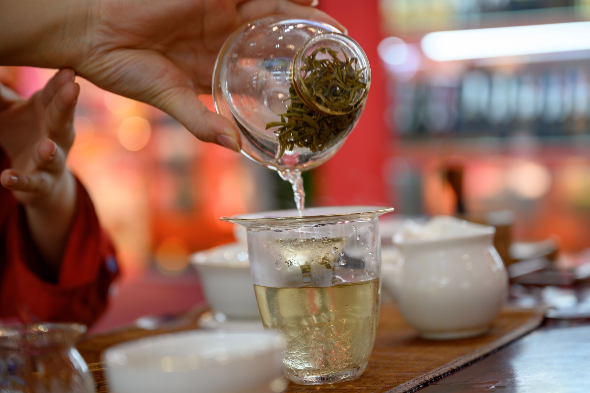Pouring oolong tea into tea cup